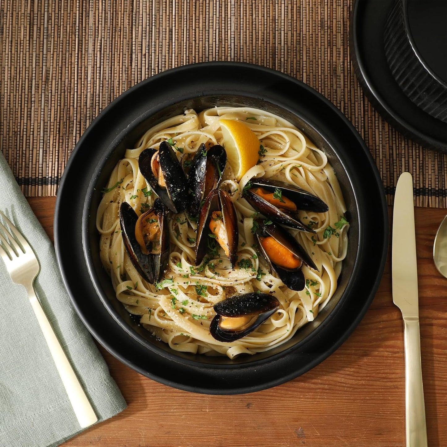 Gibson Elite Deerfield 16-Piece Stoneware Dinnerware Set – Matte Black Reactive Glaze Plates and Bowls, Stackable, Modern Design, Service for 4 – Microwave & Dishwasher Safe